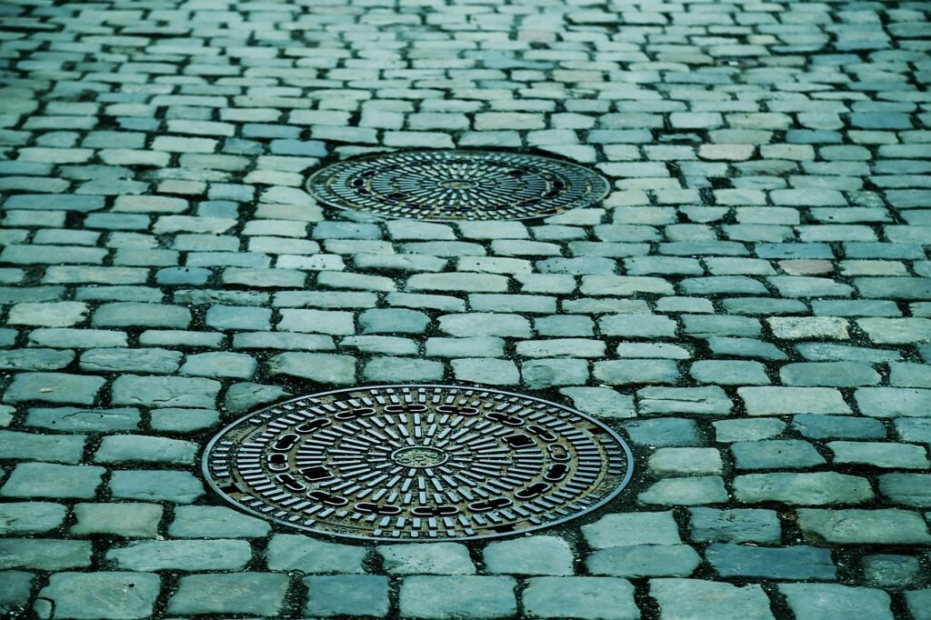 cobblestones, street, manhole covers, manhole, paving stones, pavement, road, ground, cobbblestone street, street, manhole, ground, ground, ground, ground, ground