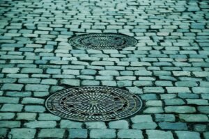 cobblestones, street, manhole covers, manhole, paving stones, pavement, road, ground, cobbblestone street, street, manhole, ground, ground, ground, ground, ground
